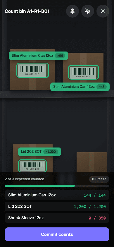 The Cairn augmented-reality count view during a cycle count: green tracked boxes with live tally chips over every case on the shelf, and a capture sheet showing counted-versus-expected per item with a commit-counts button